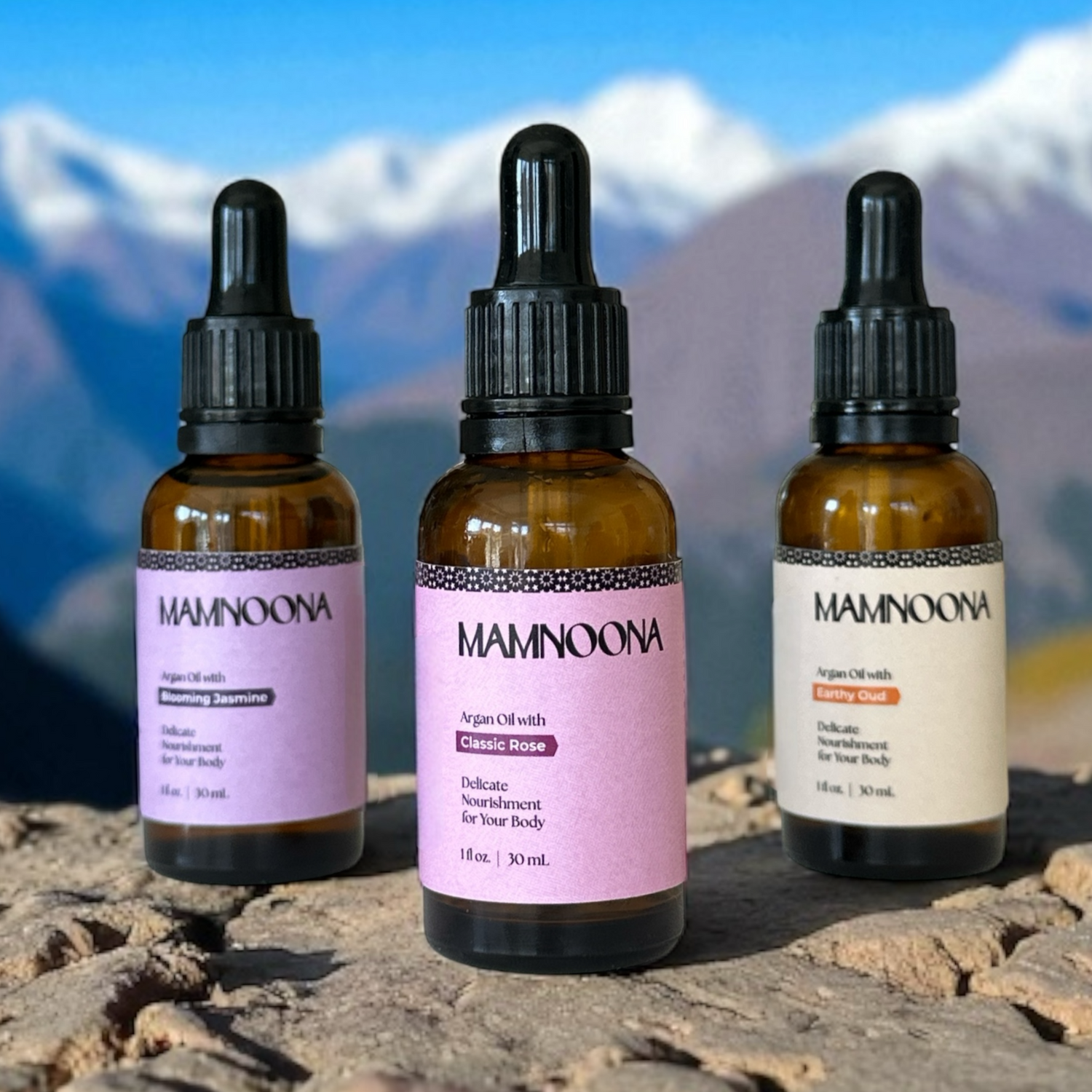 Three MAMNOONA Argan oil bottles