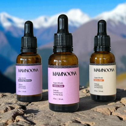 Three MAMNOONA Argan oil bottles